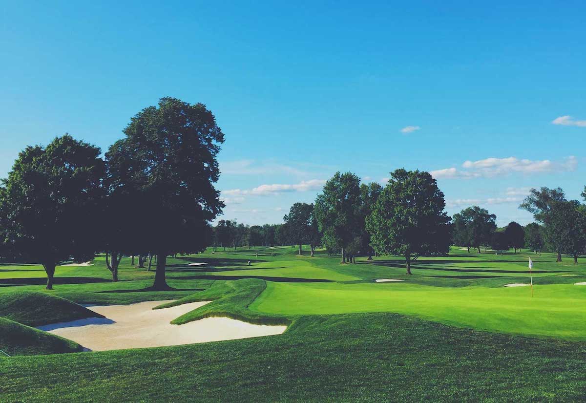 image of golf course with blue sky and sand trap in the foreground in Murfreesboro